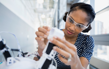Person with glasses on looking at technology
