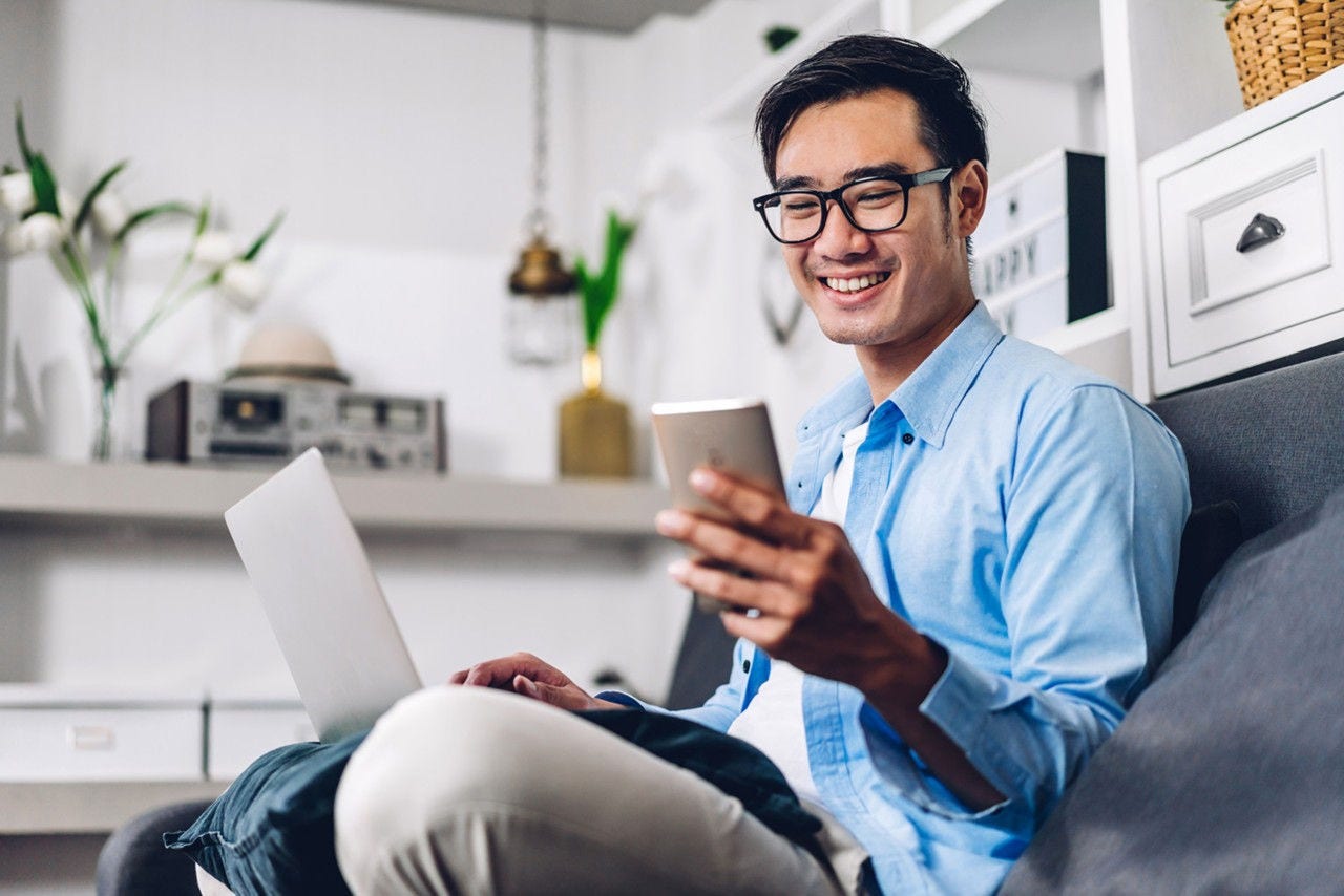 Man using mobile phone and computer