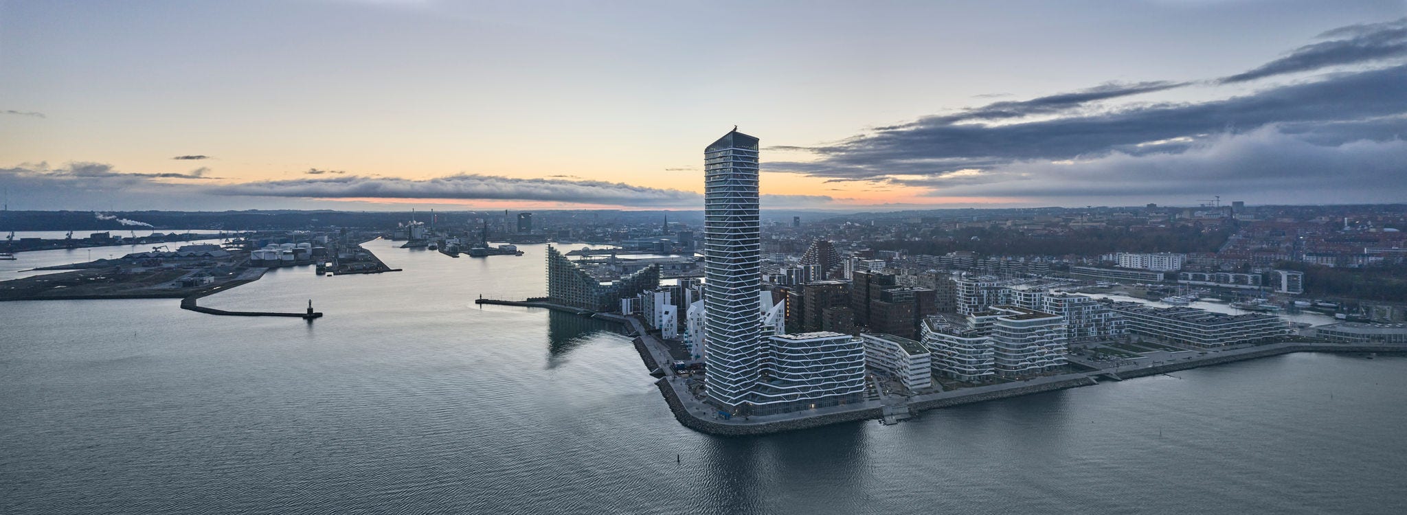 Drone point of view sunset at Aarhus waterfront. New buildings at Aarhus Island