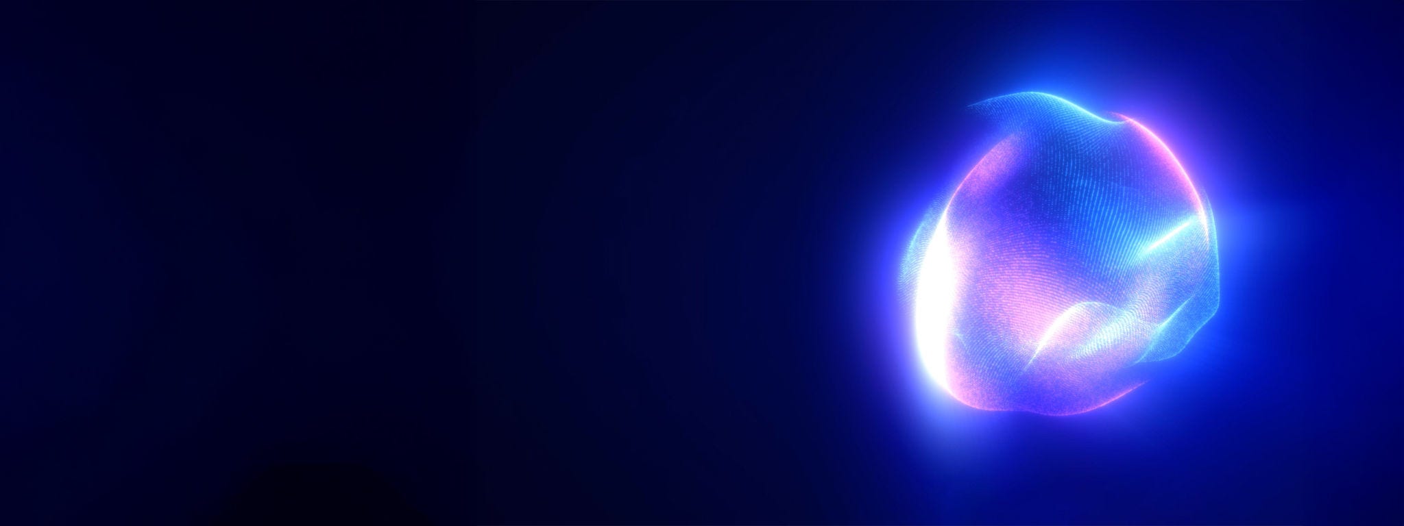 Glowing bright light orb against a dark background