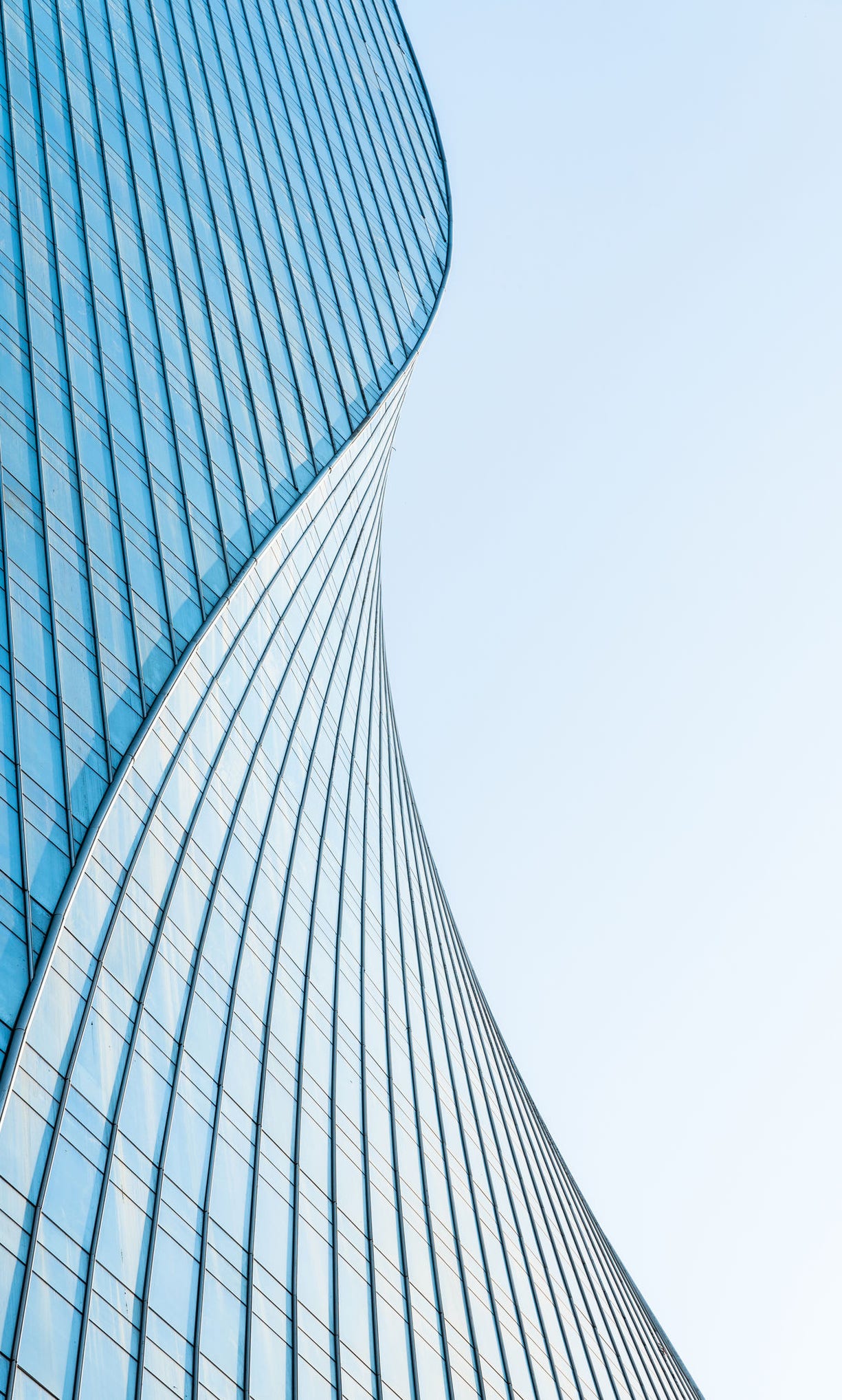 close up view of  unknown modern building exterior and glass windows.