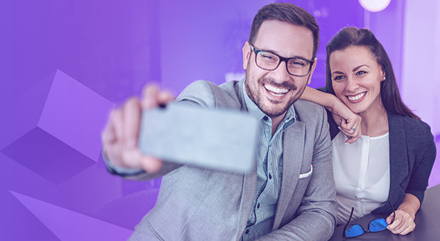 young man and woman taking selfie