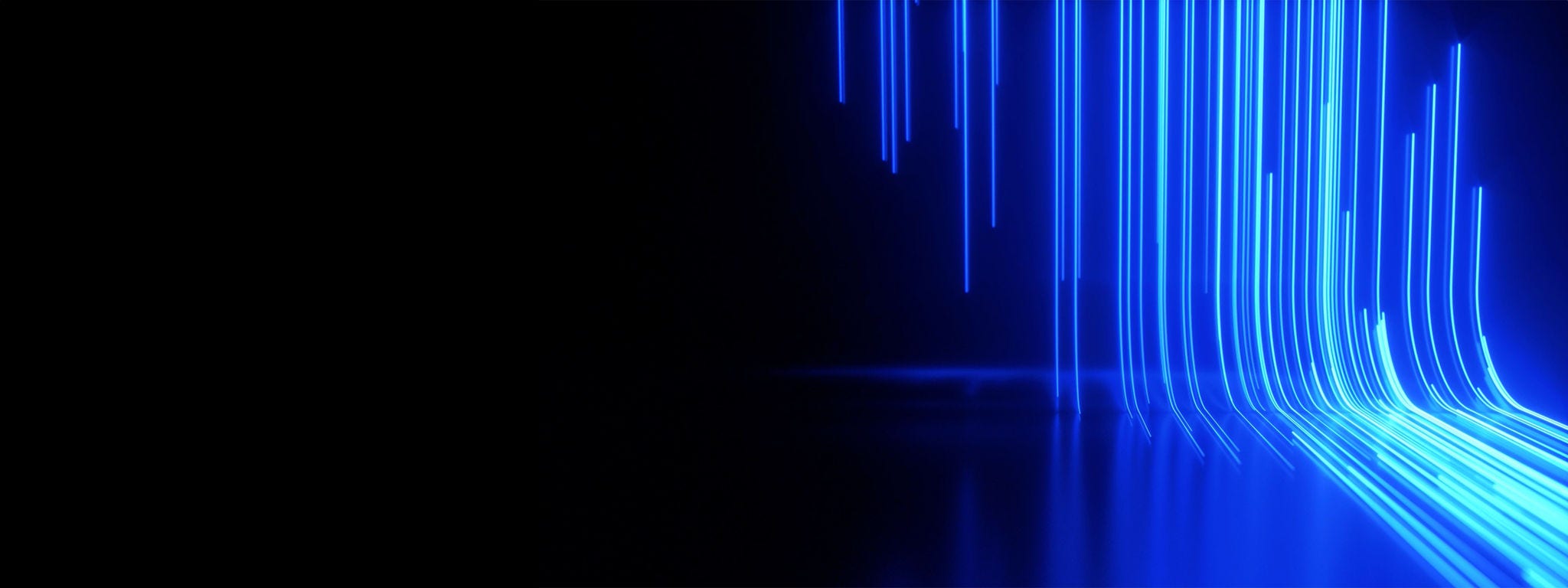 Bending streaks of neon cobalt light against a dark background