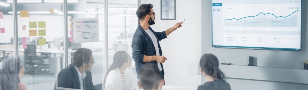 Person pointing at a presentation