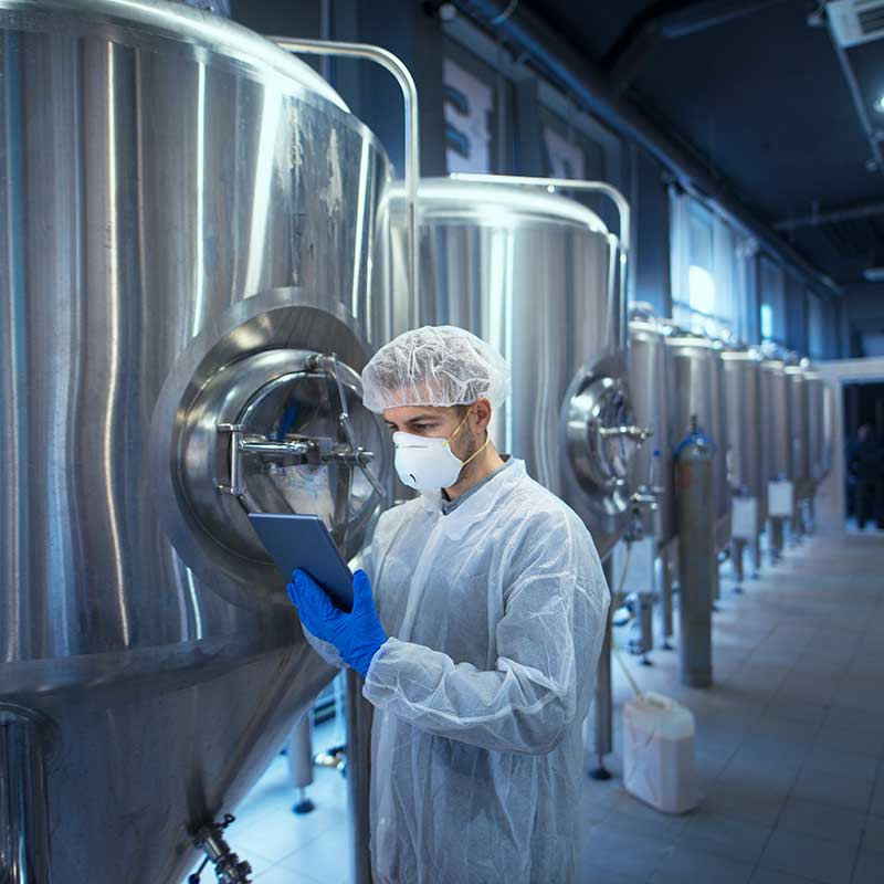 Scientist working with vats