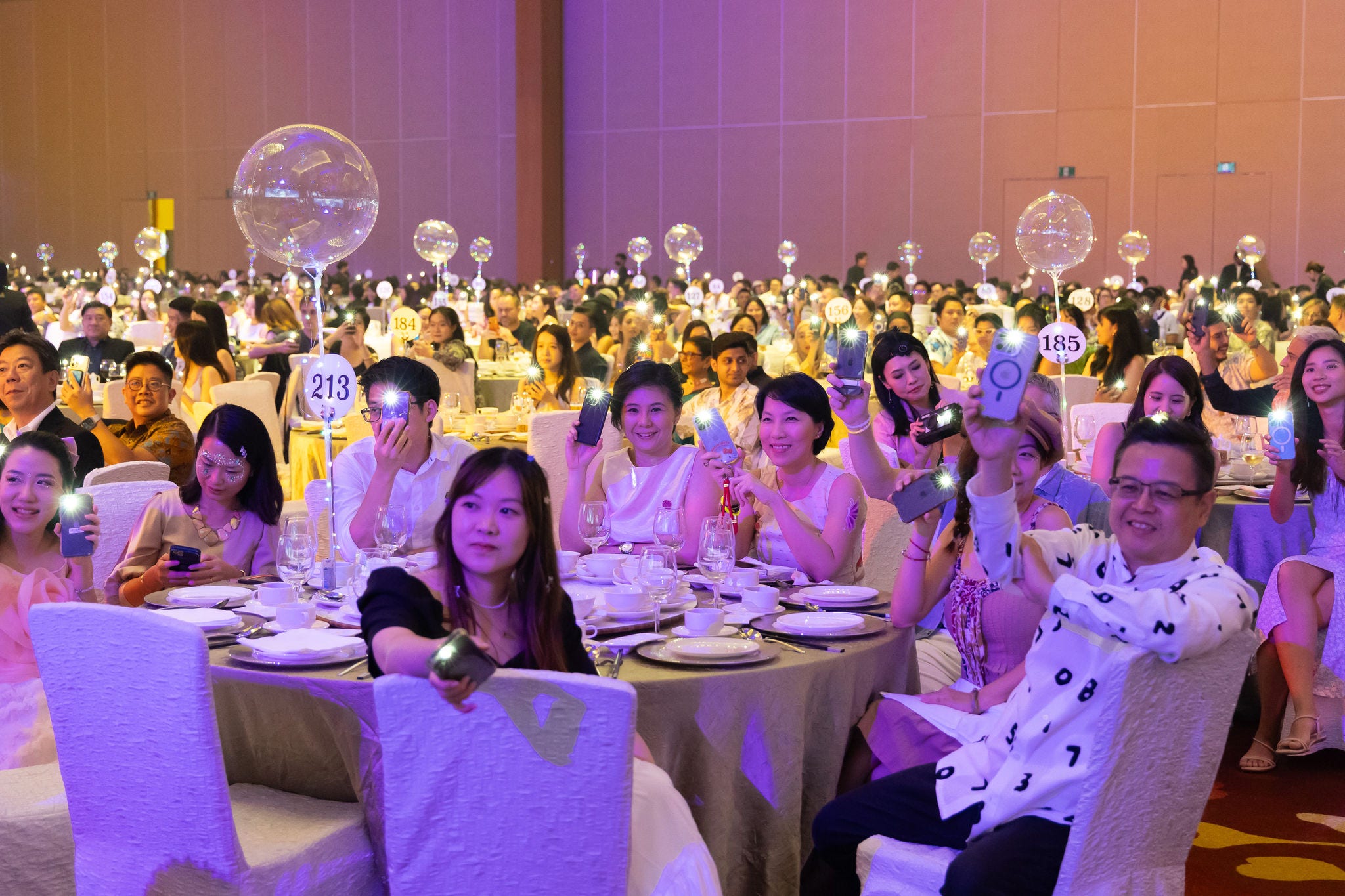 KPMG Dinner & Dance 2024 - crowd with flashlights