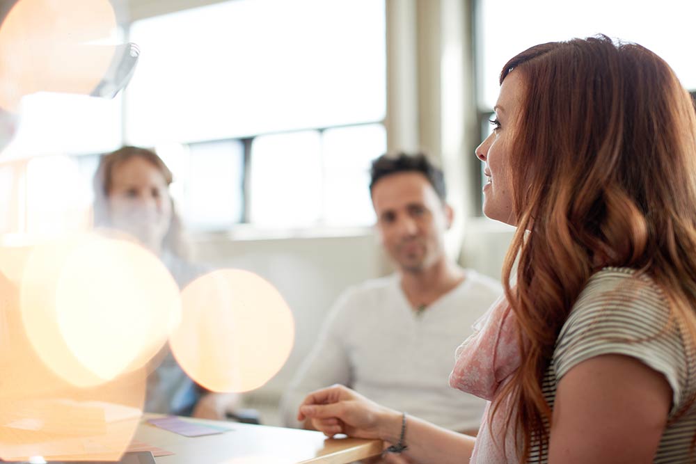 Woman speaking in meeting