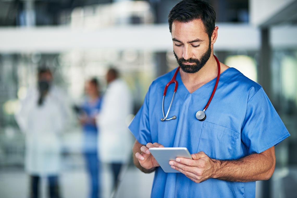 Doctor looking at tablet