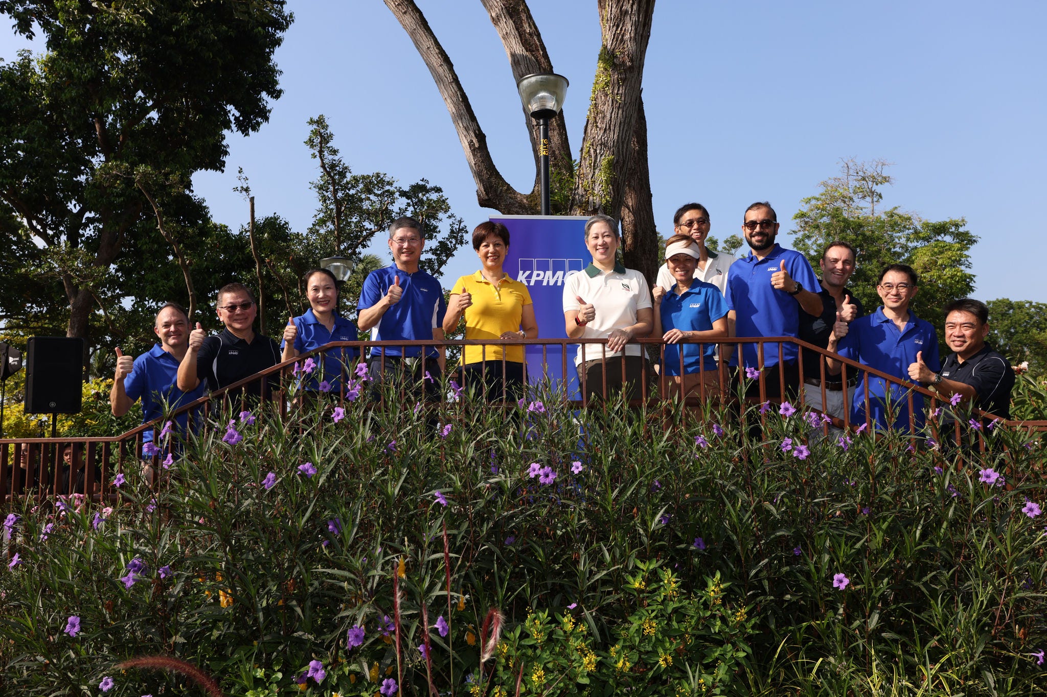 Group photo of KPMG ops comm, Minister Indranee Rajah, and NParks at the inauguration of the KPMG Wellness Garden