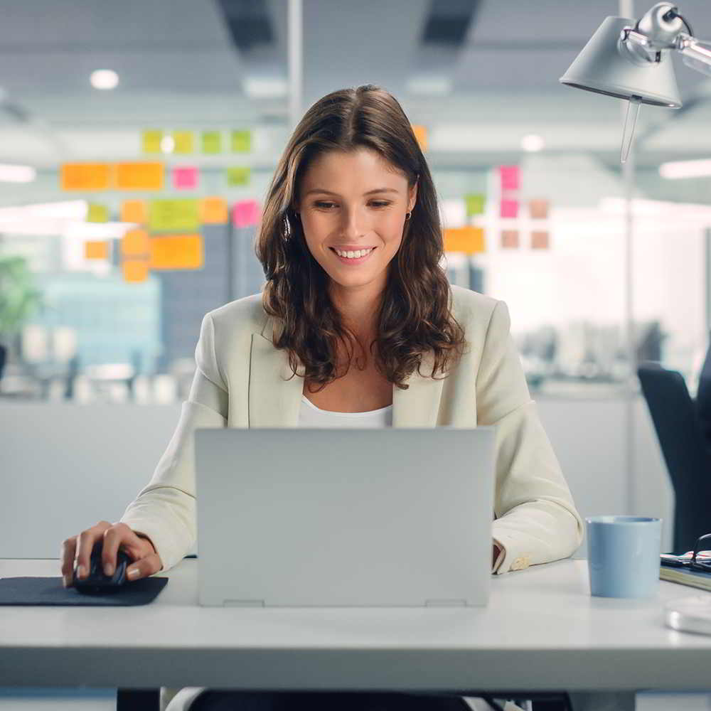 Woman working on laptop in office