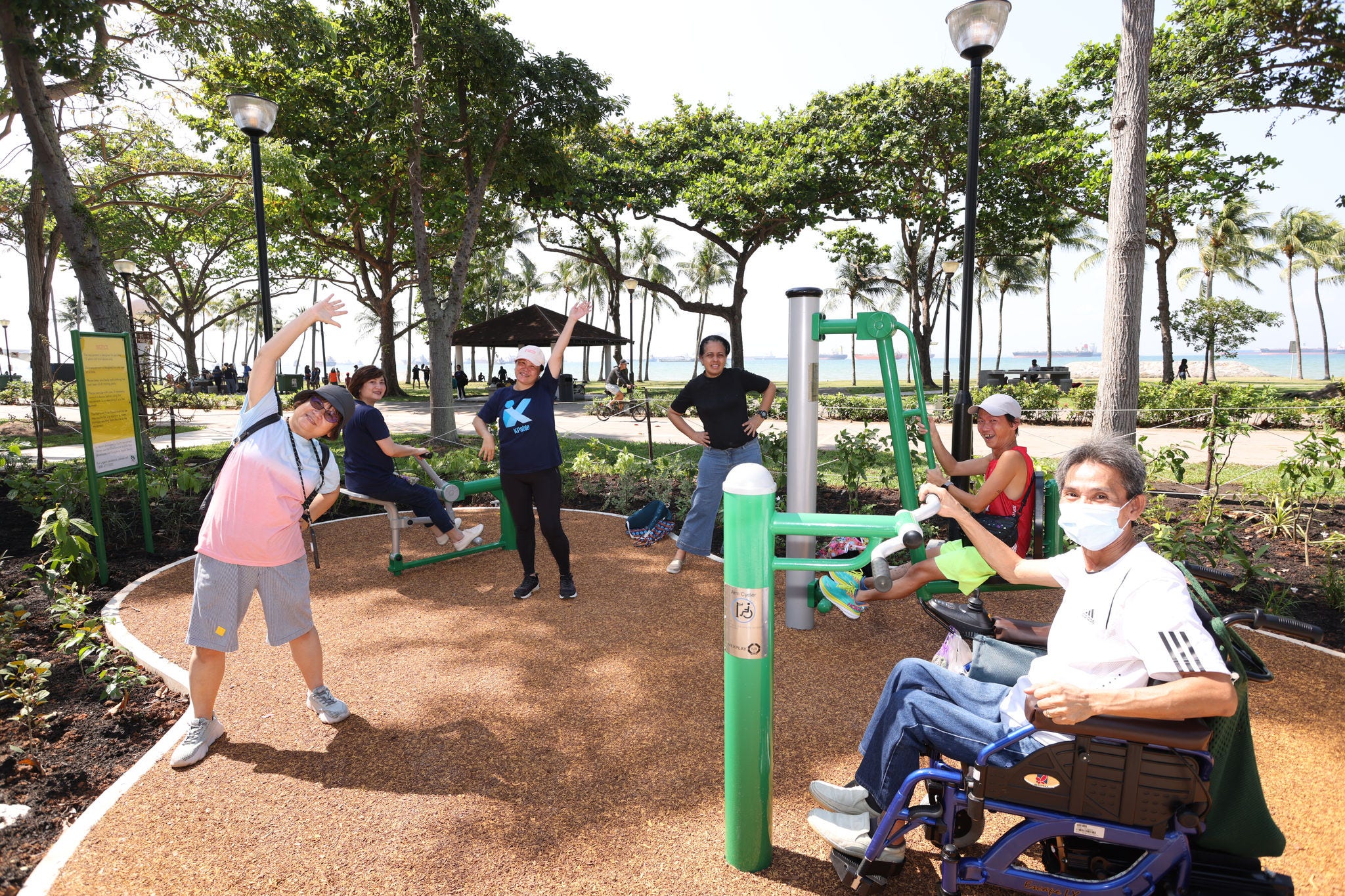 People using the Nature Fitness Area at the KPMG Wellness Garden
