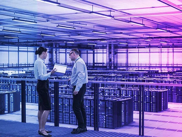 Two people in data centre