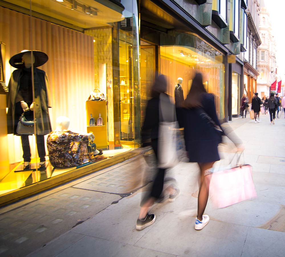 Blurred shoppers on street