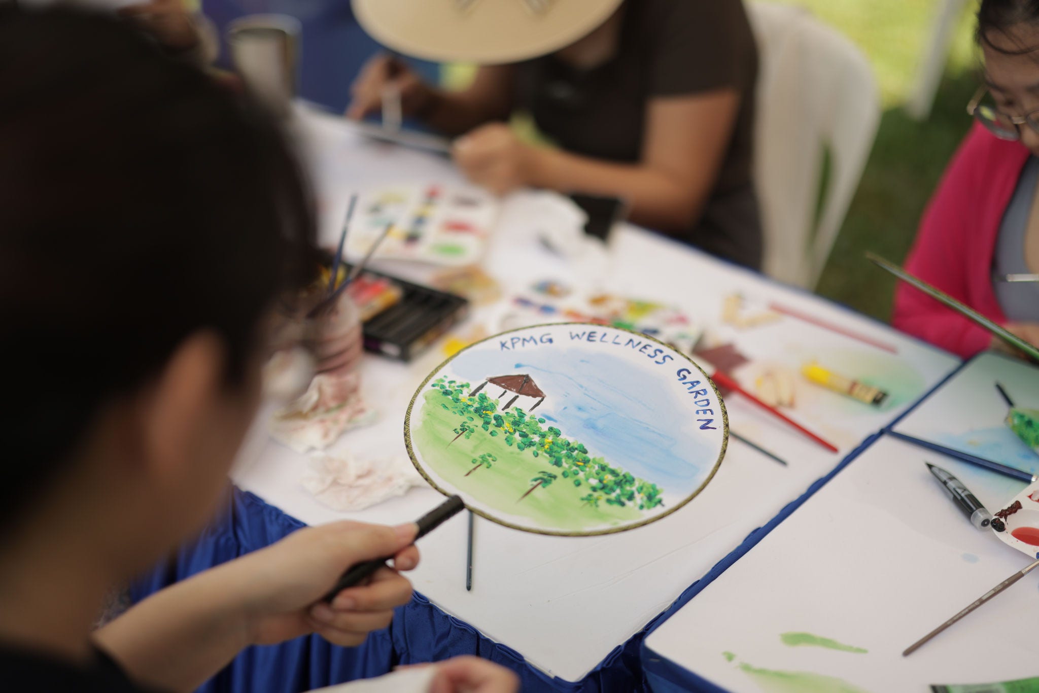 Fan painting workshop at the inauguration of the KPMG Wellness Garden