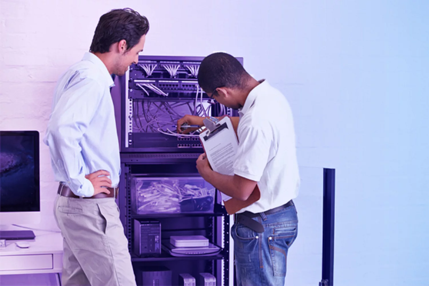 Illustration of two colleagues on a laptop