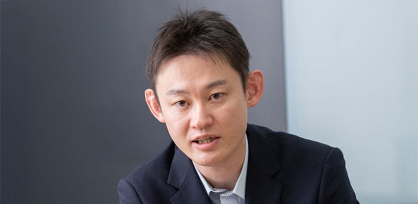 Japanese alt text: KDDI　奥氏