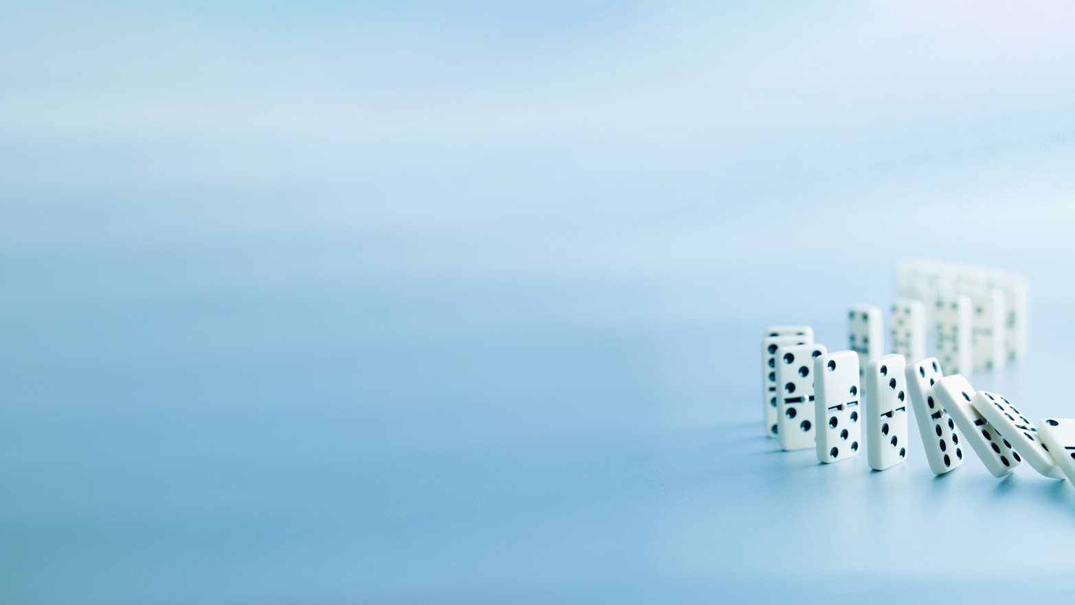 a line of dominoes falling