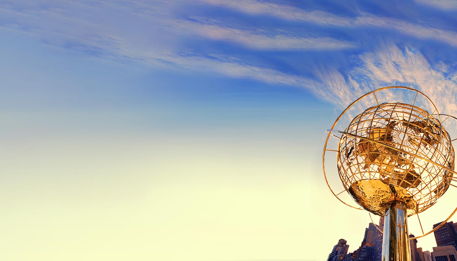 globe sculpture against a blue sky