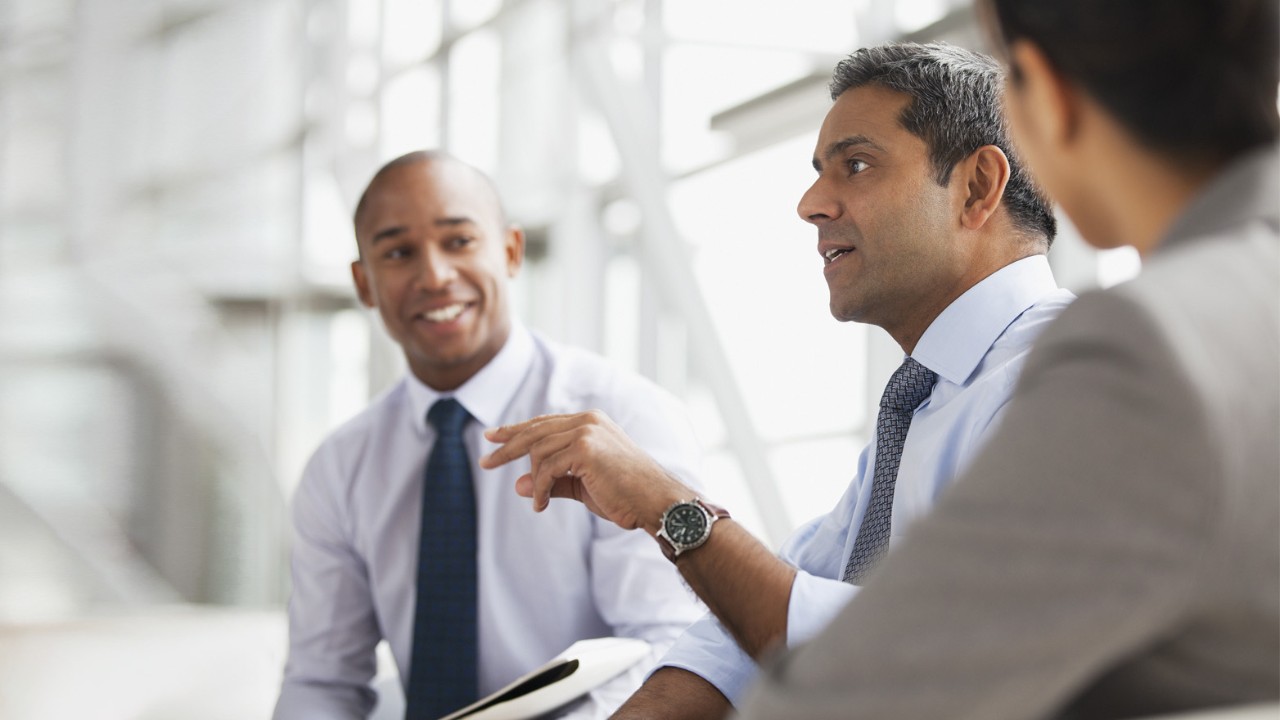 smiling colleagues having a discussion