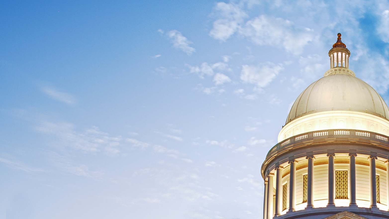 a capital building tower against a blue sky
