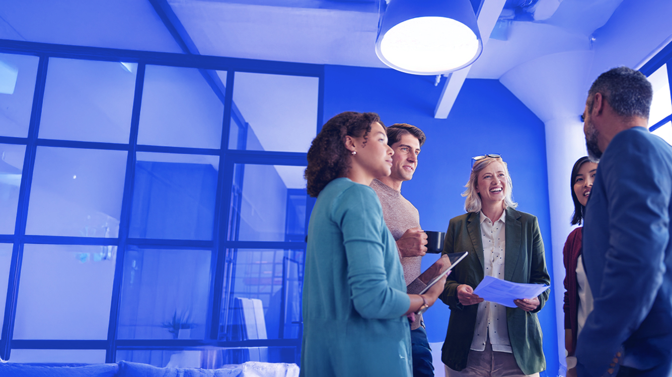 A group of people standing in a room