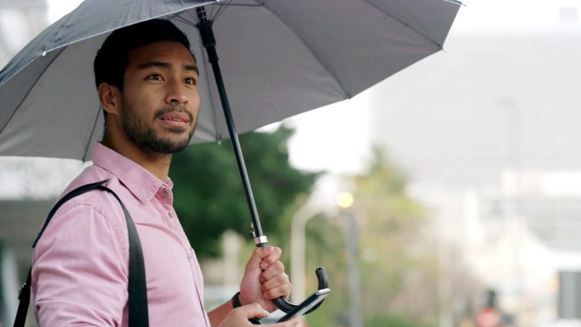 man holding umbrella