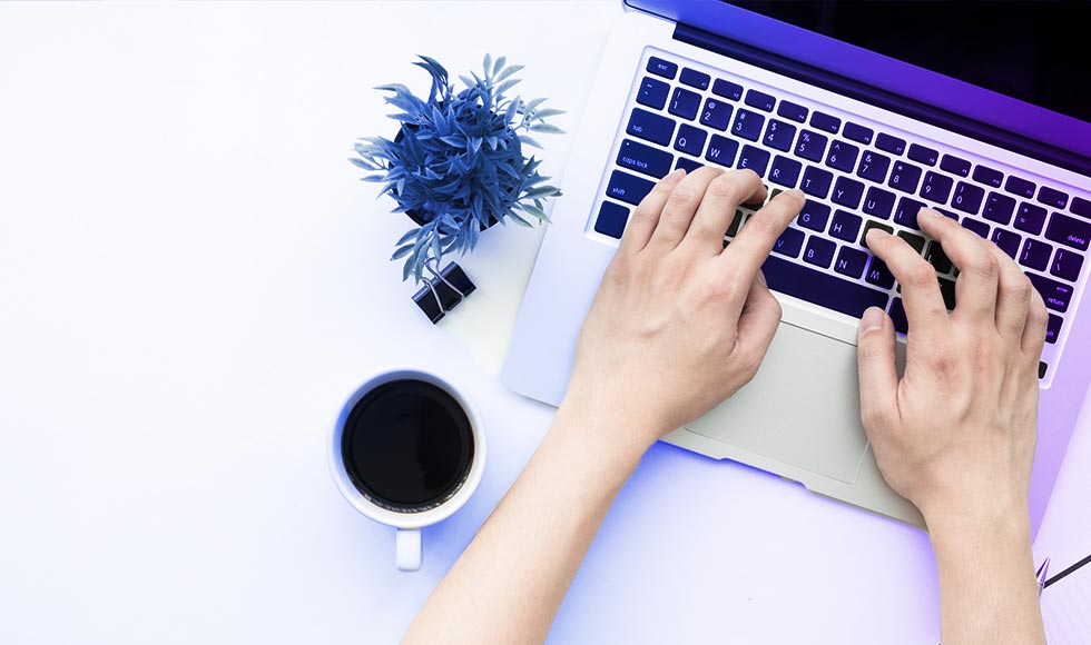 hands on laptop typing