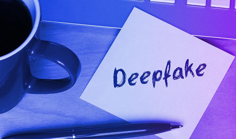 note with the words: Deep fake written with a marker
