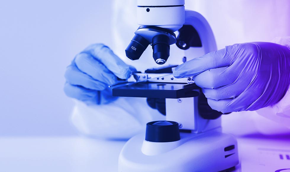 closeup of microscope in use, looking down