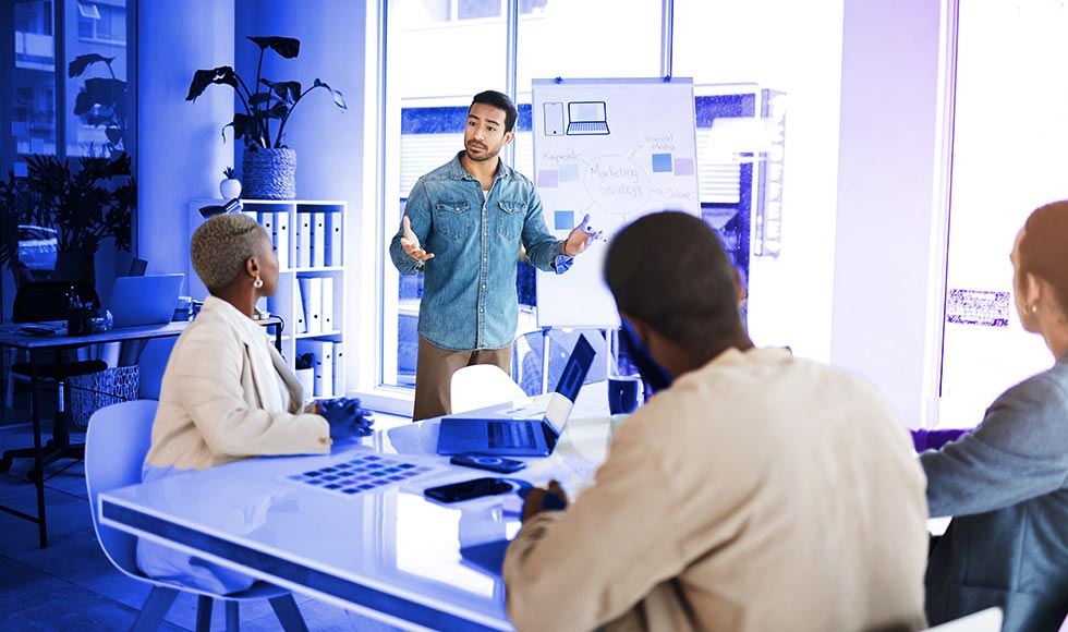team of people having a discussion in an office