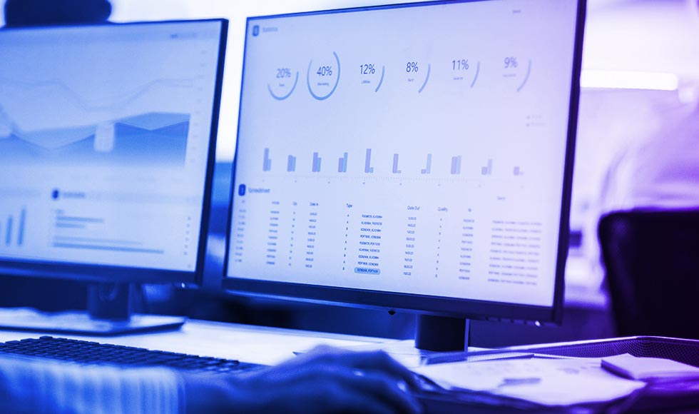 two monitors with data displaying